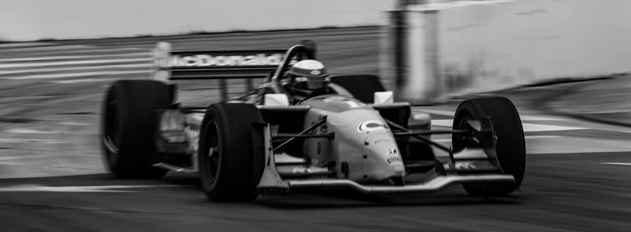 F1 car at speed on a racing circuit