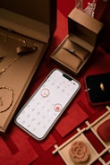 Jewelry, engagement ring, and calendar on red background