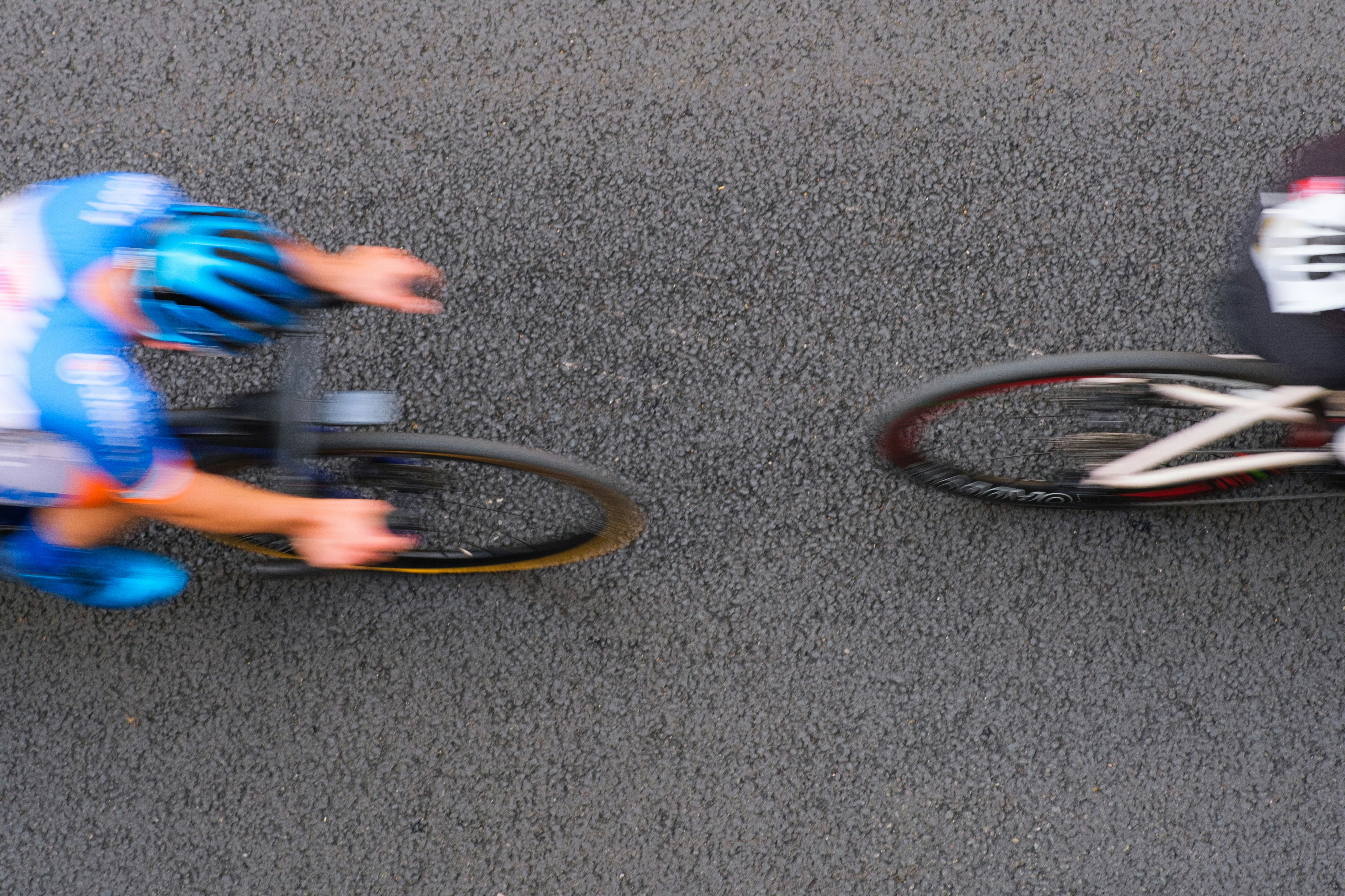 Cyclists racing on a road with motion blur