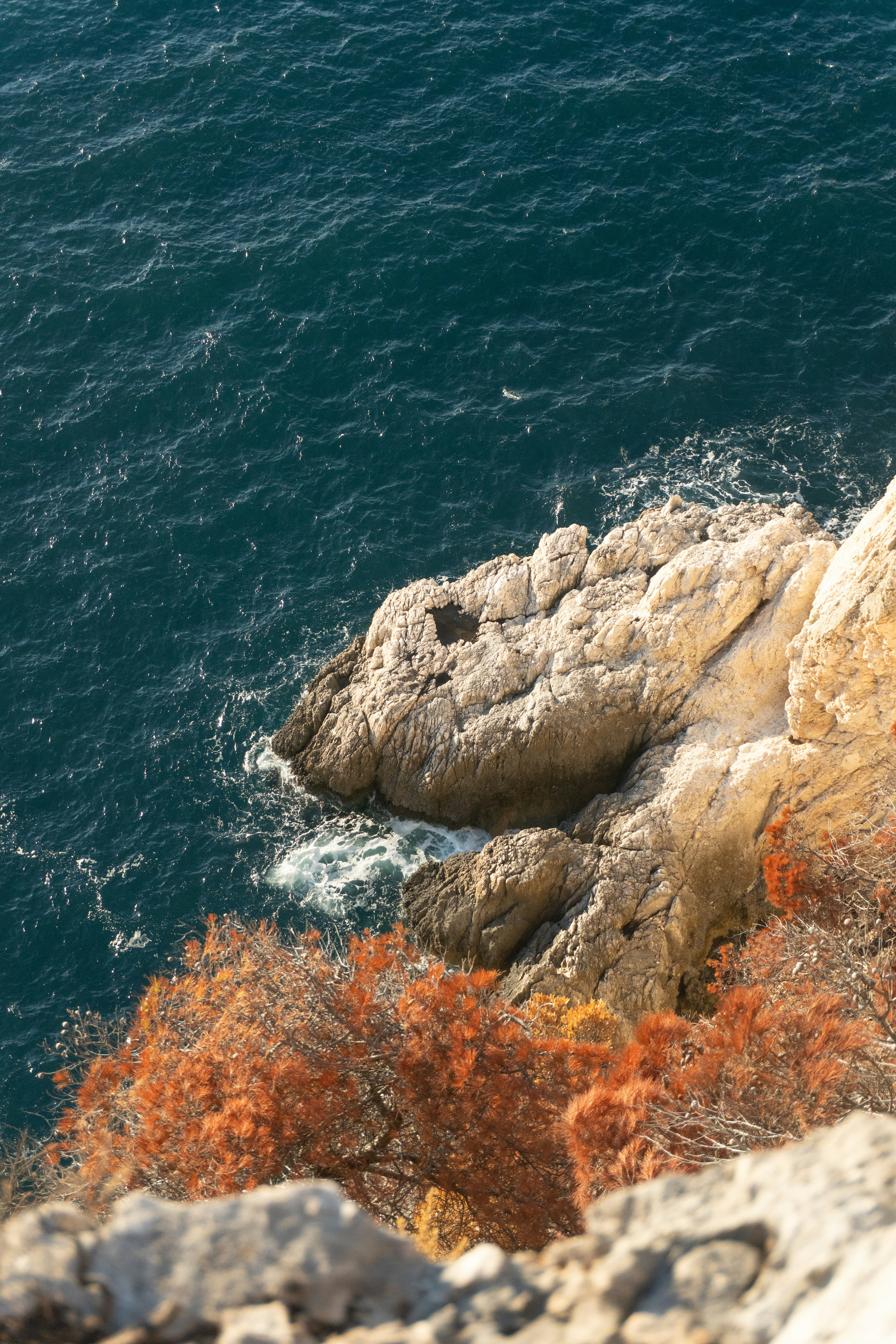 Rocky coastline with choppy blue ocean waves. photo – Free Sea Image on ...