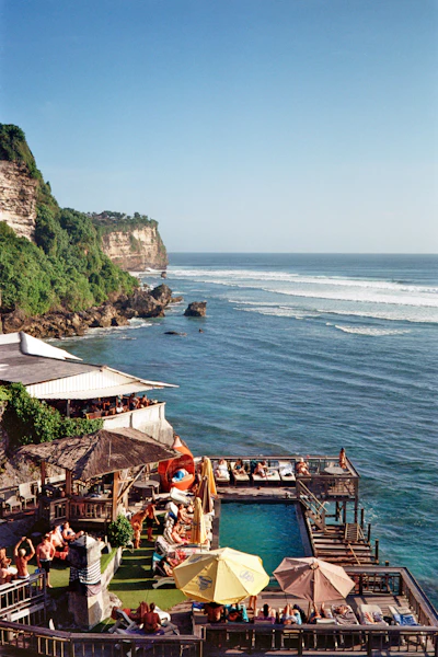 A cliffside pool overlooking the ocean at sunset