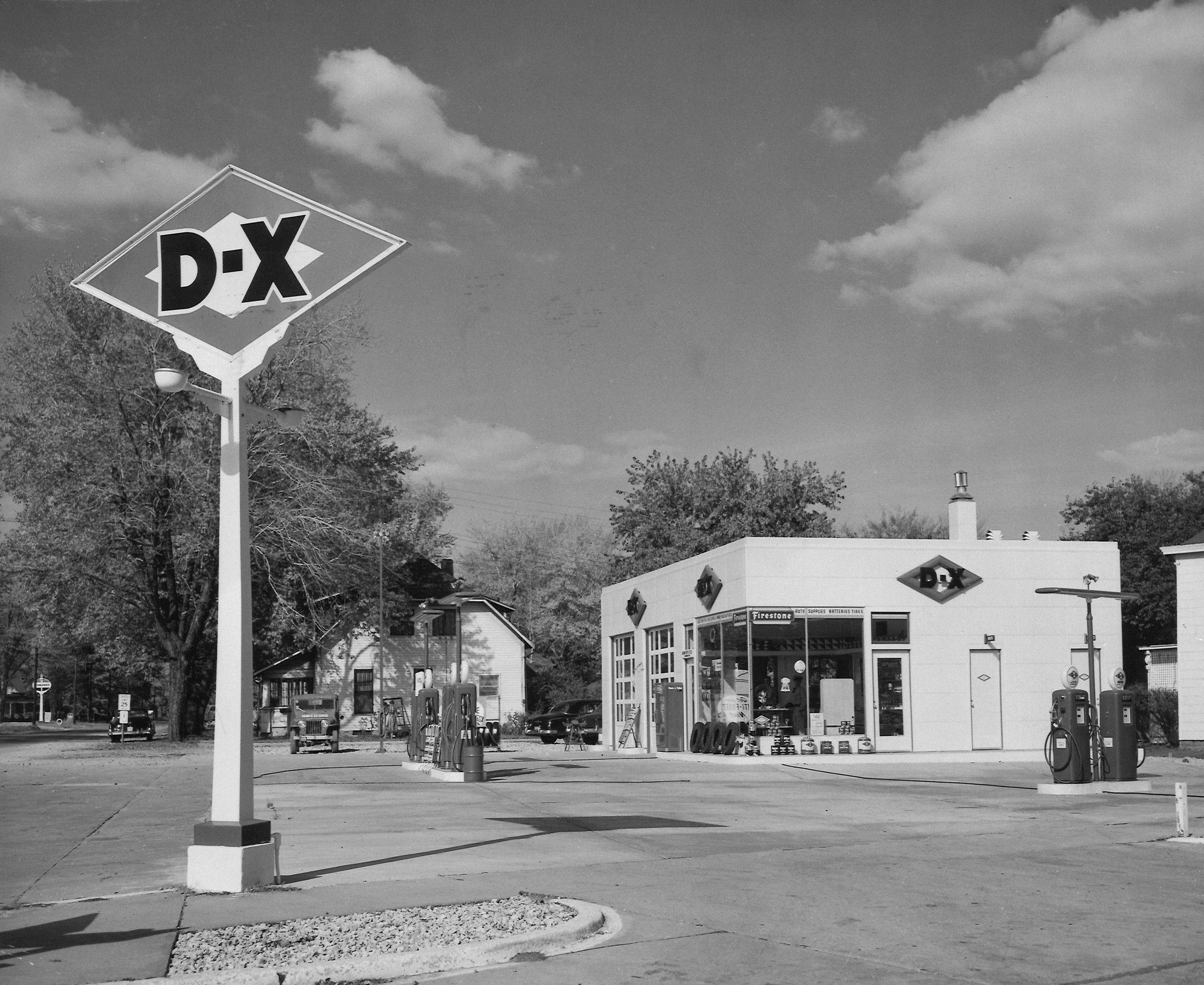 Vintage dx gas station with pumps and sign