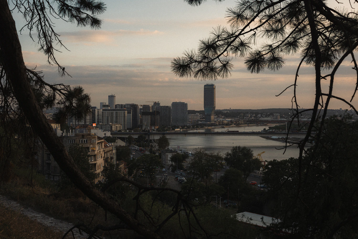 Belgrade skyline by the river at sunset