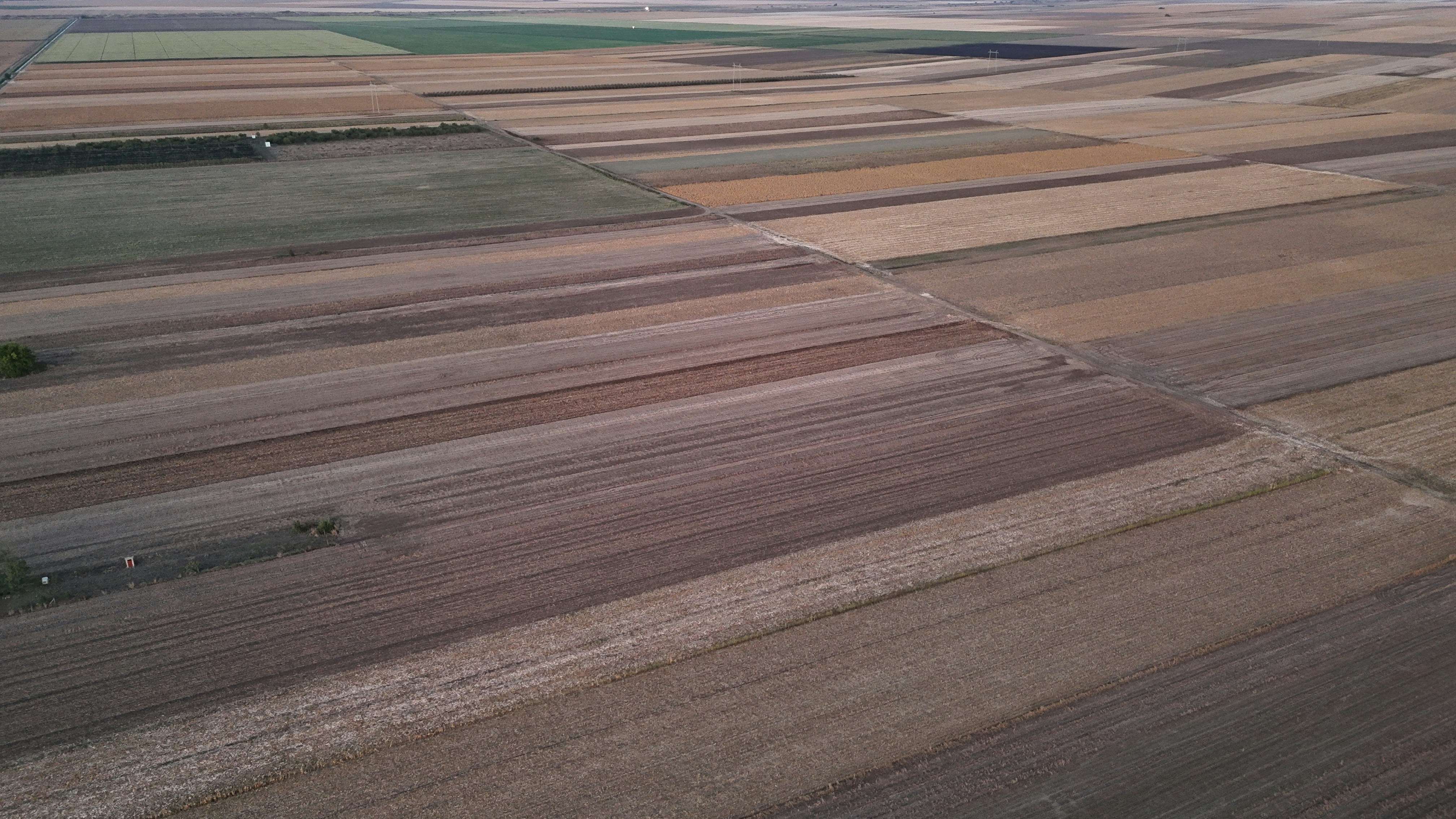 Aerial view of agricultural fields with diverse crops.