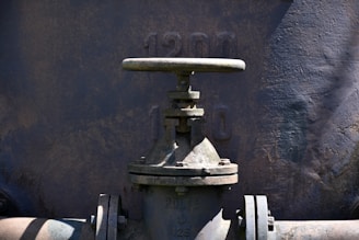 Close-up of an old industrial valve flanges and flanged upwith date 1901.
