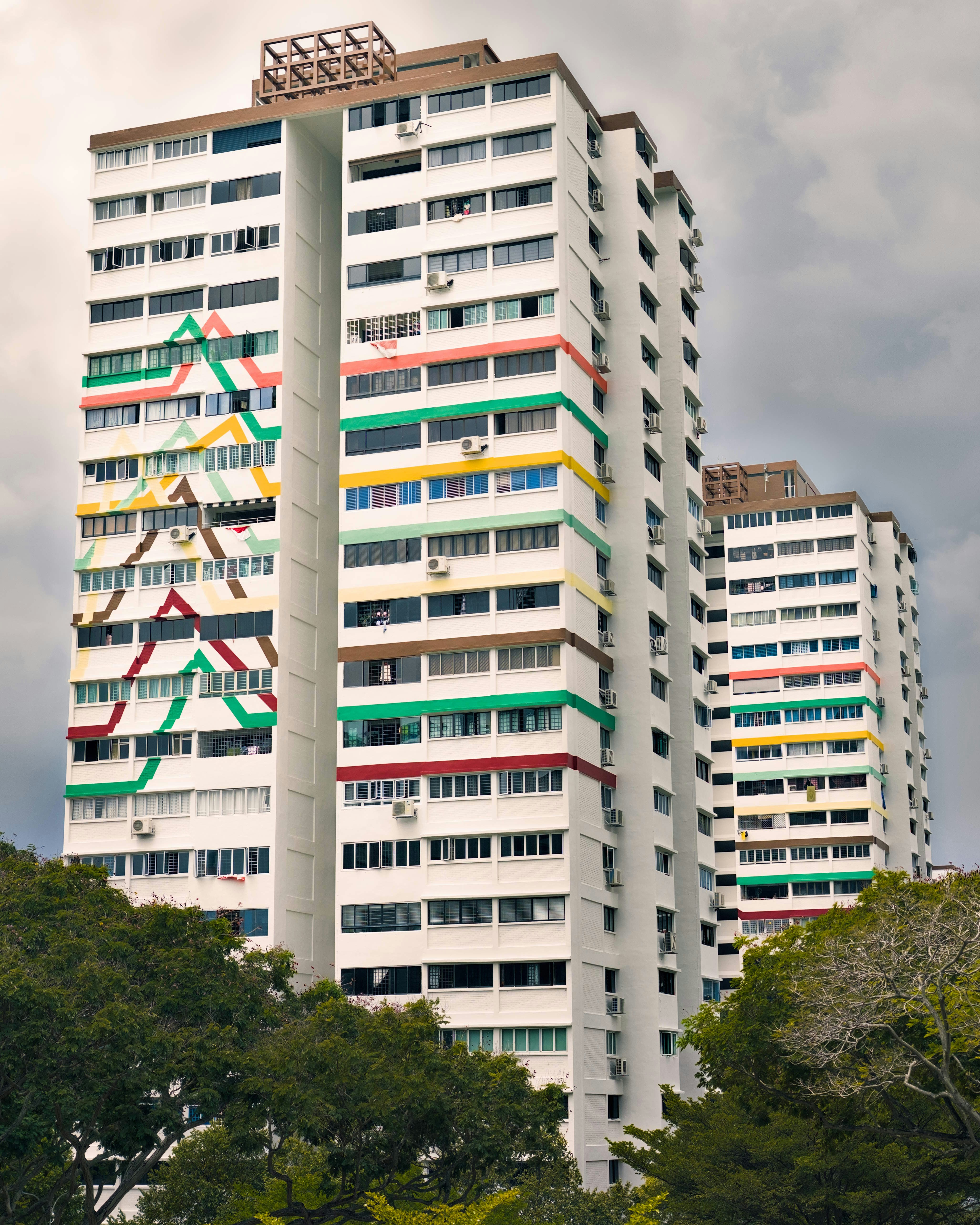 Tall apartment buildings with colorful geometric designs.