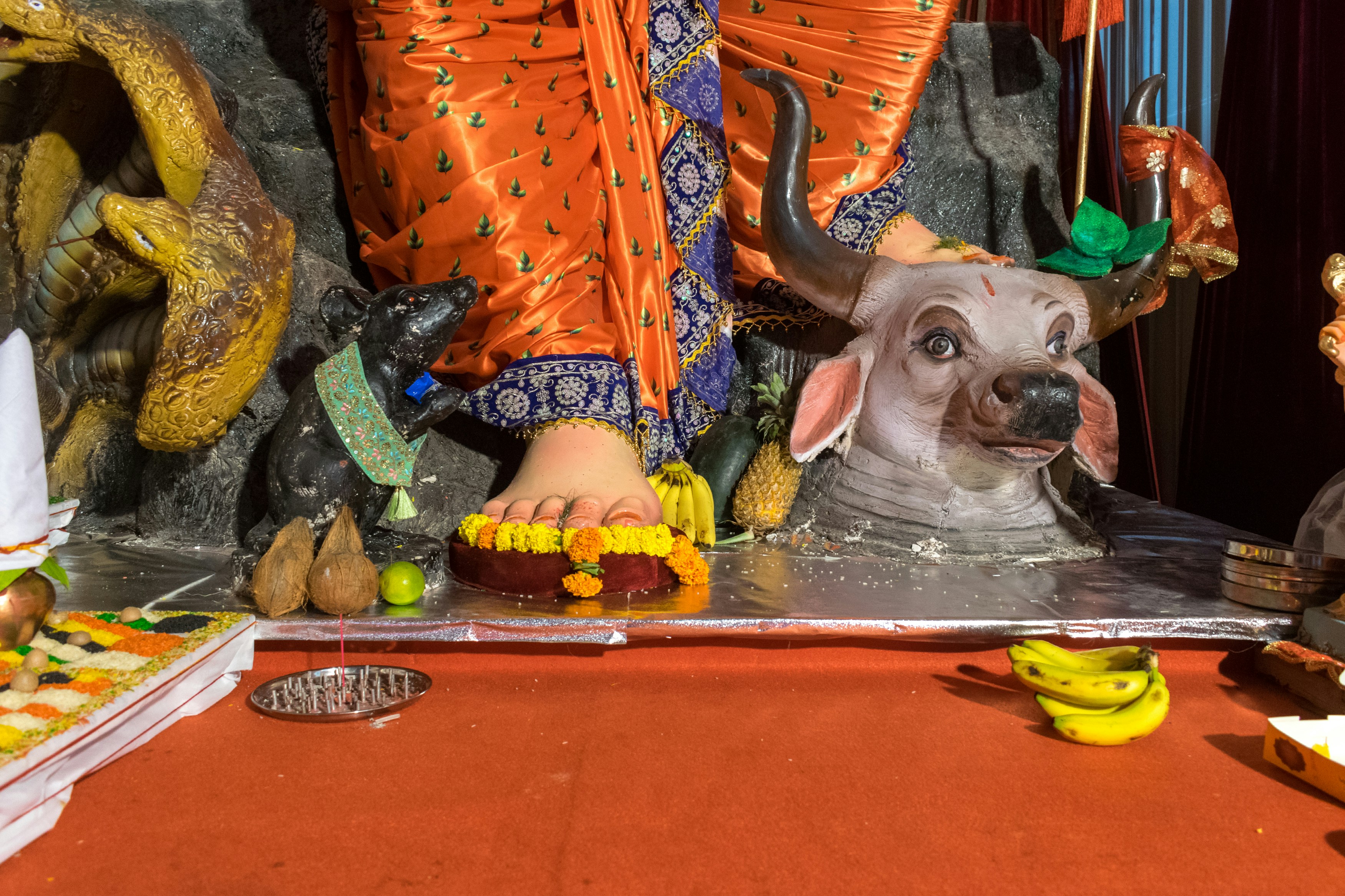 A statue of a deity with a buffalo head.