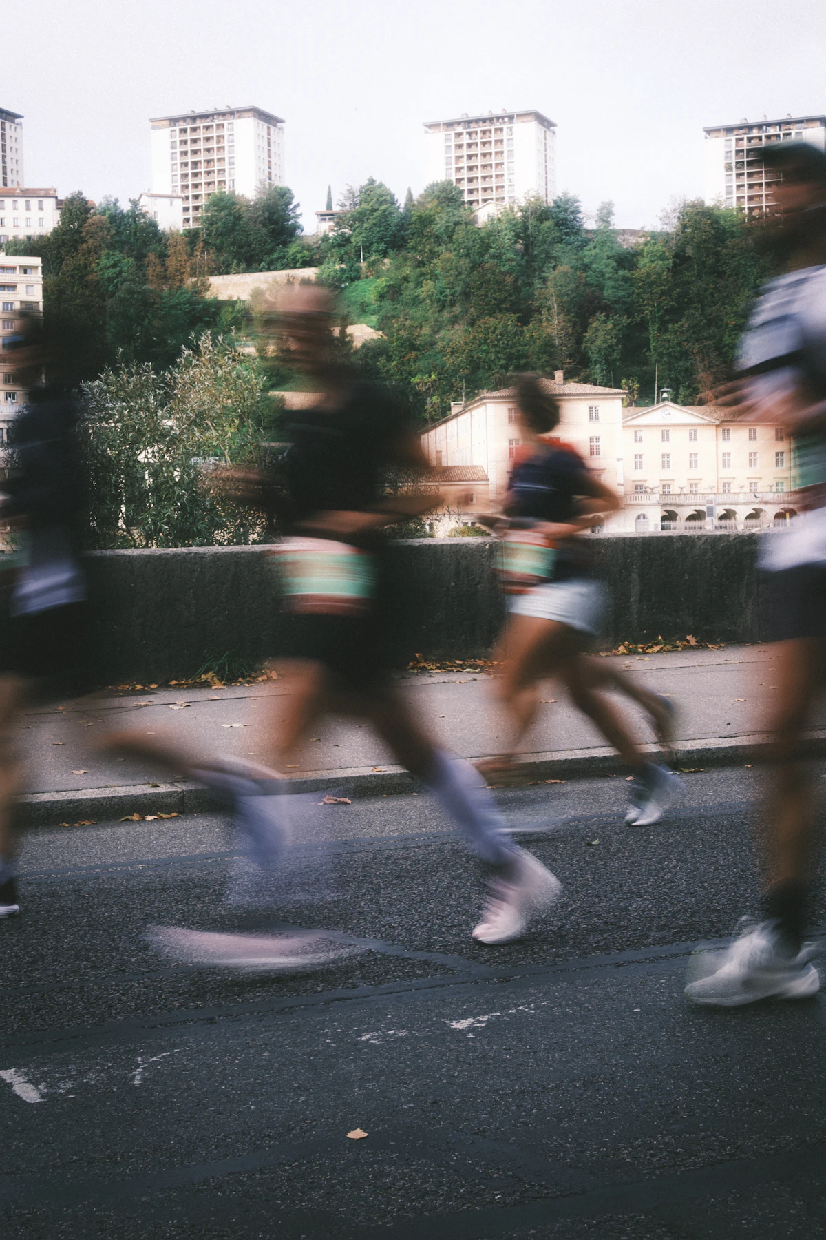 Motion-blurred marathon runners on an urban course