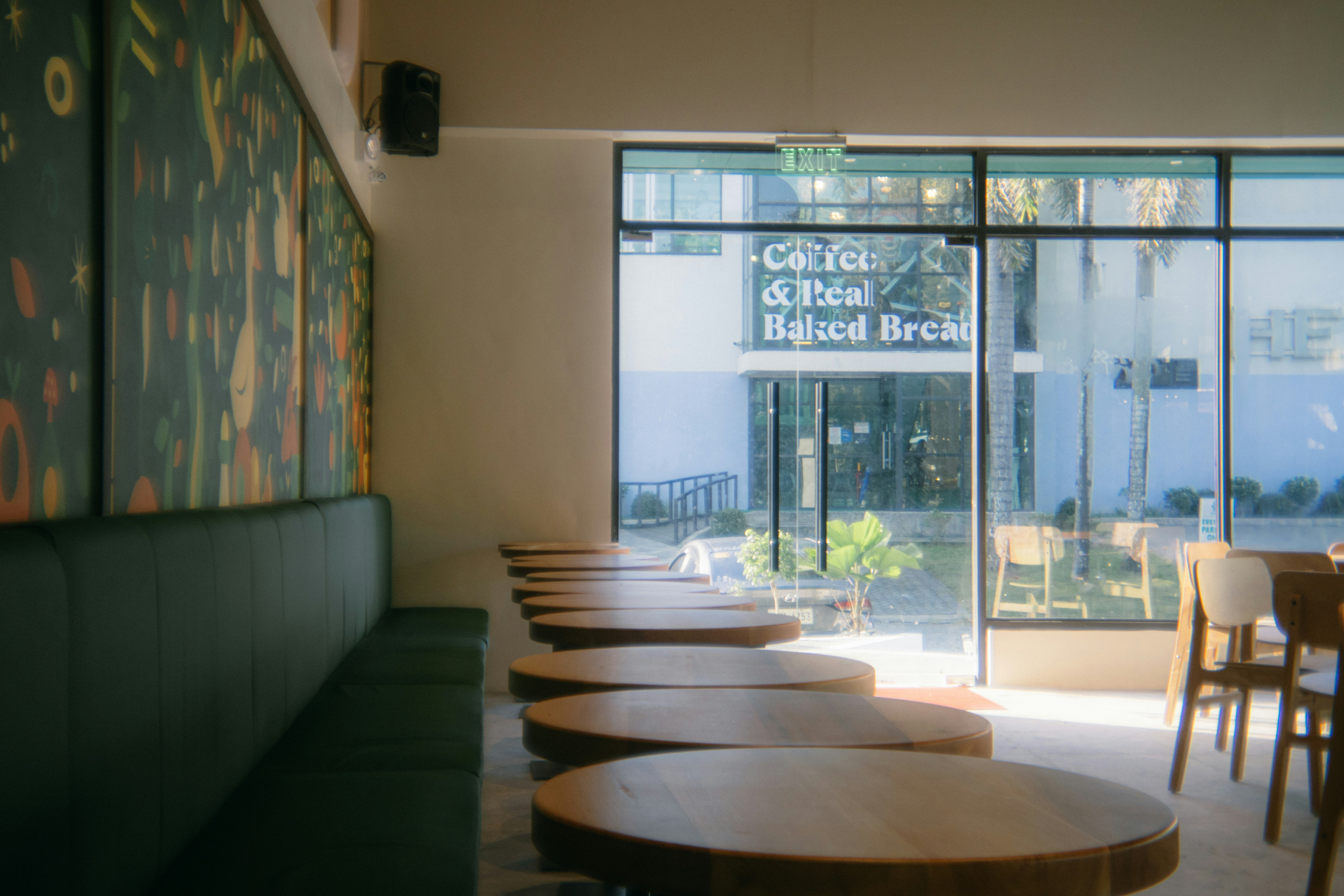 Empty cafe with green booth seating