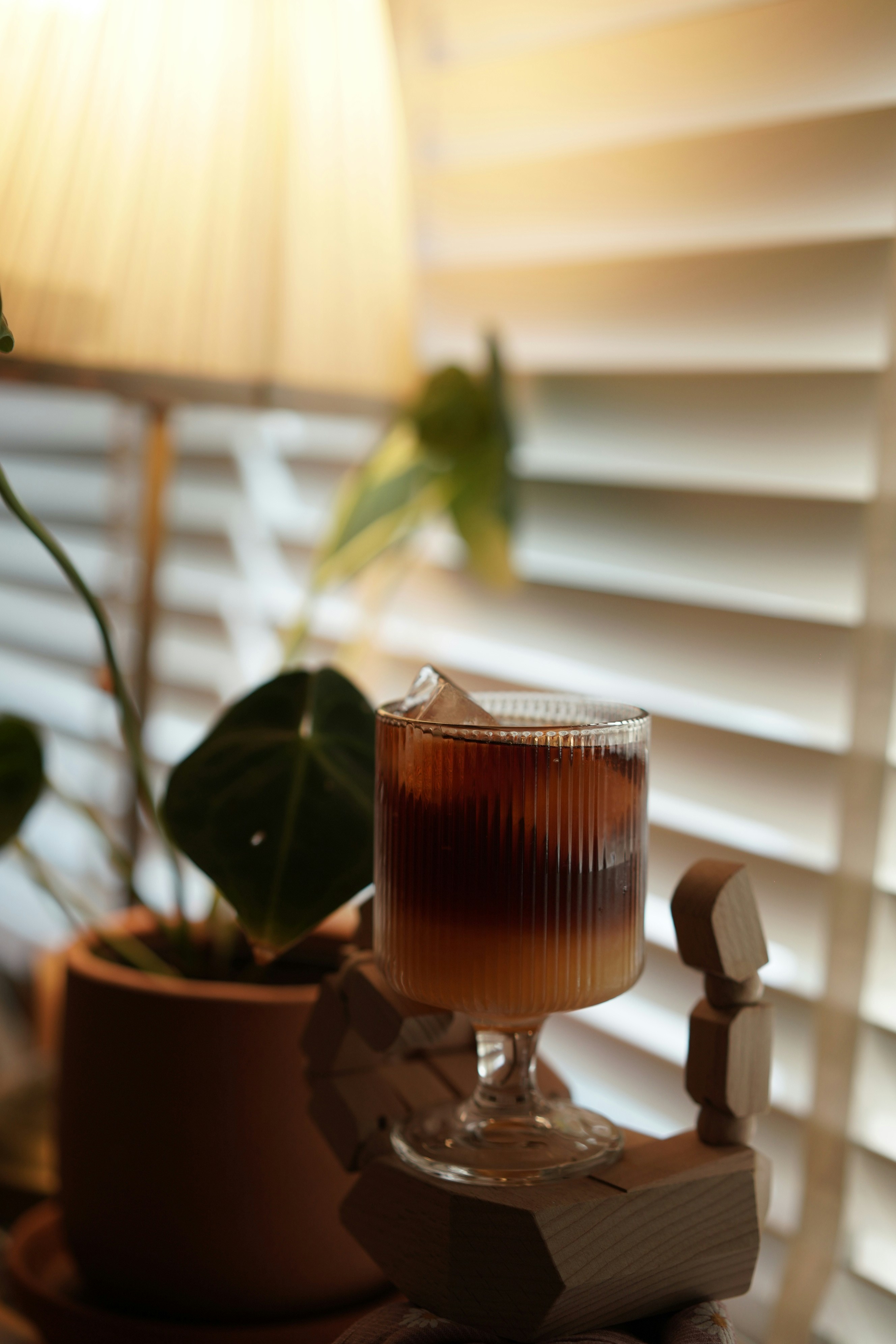 Iced coffee in a glass with ice cubes.
