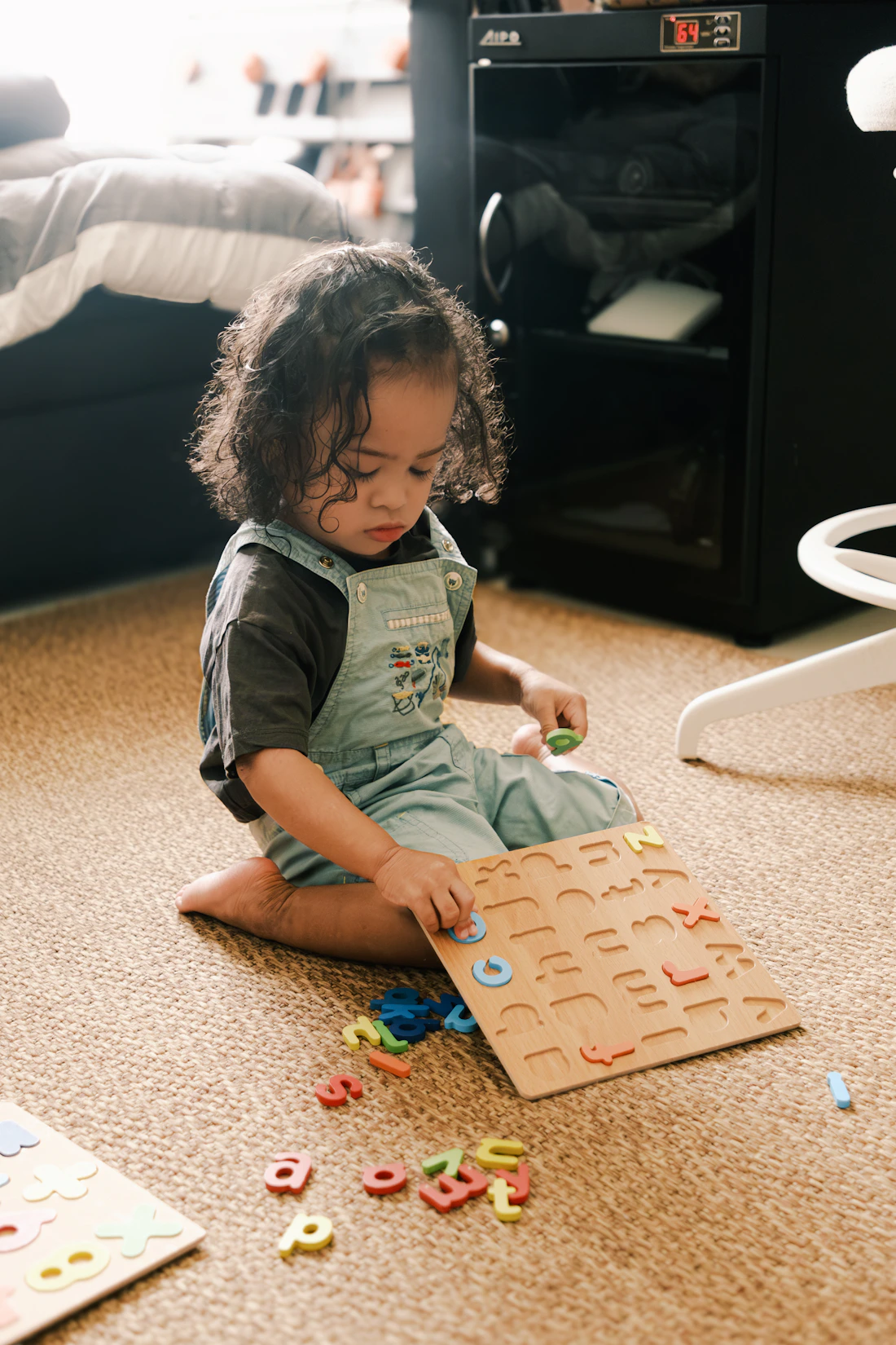 Child working with educational puzzle pieces