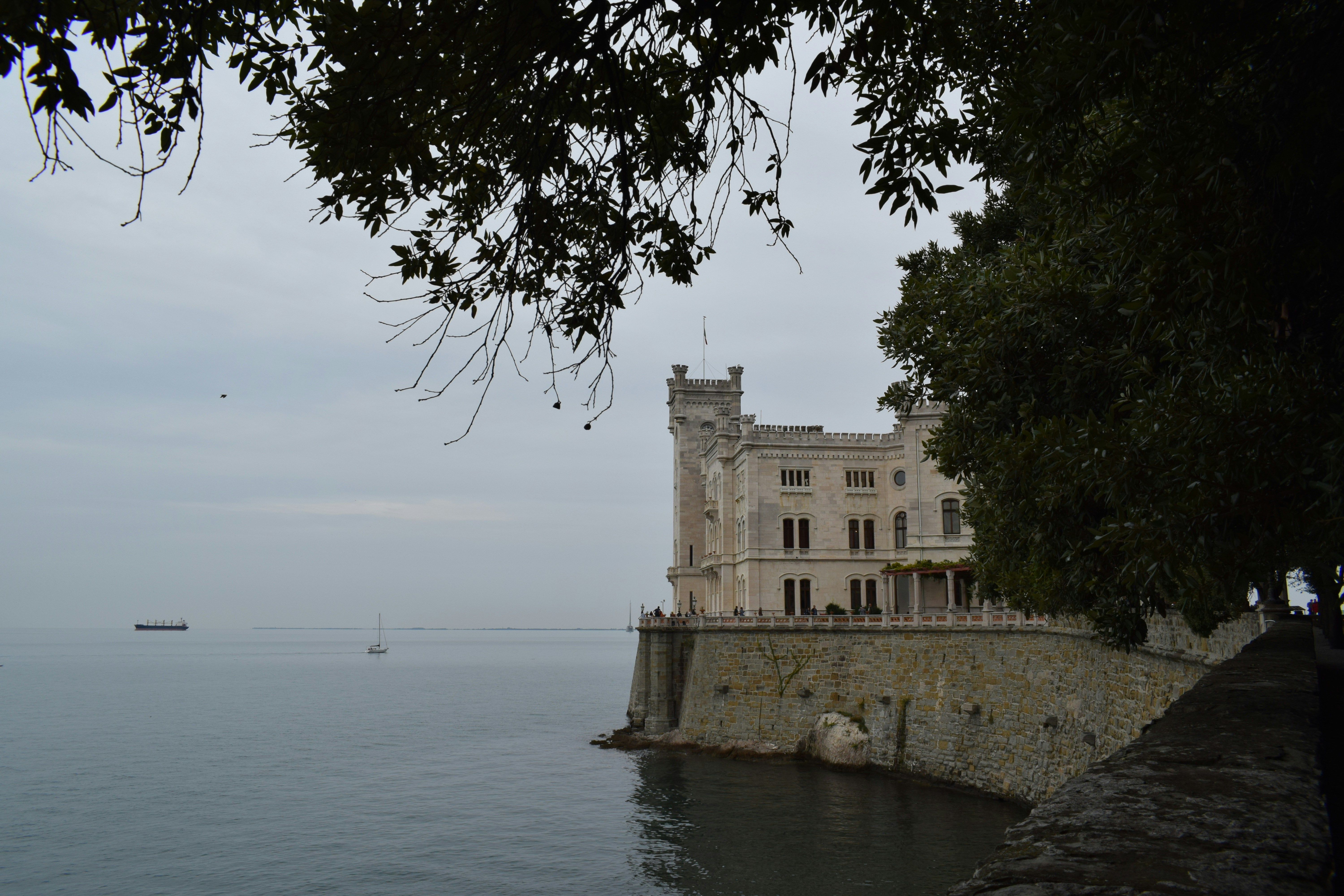 Castle on the sea under a cloudy sky.