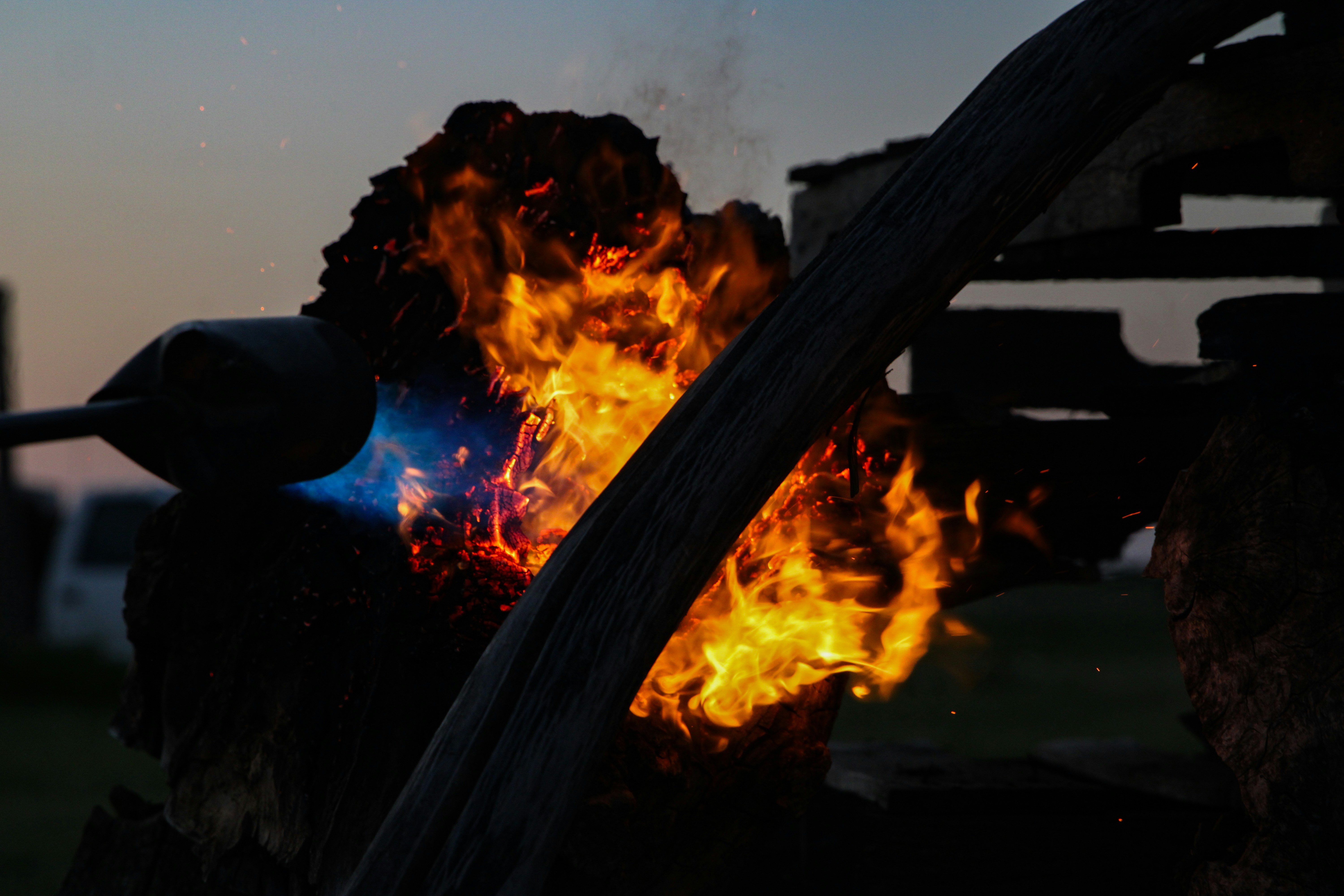 Close-up of a blowtorch flame igniting wood