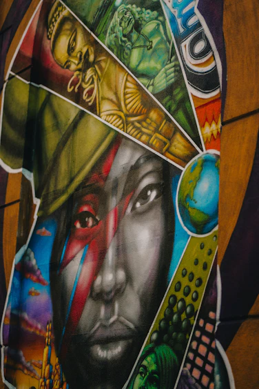 Graffiti art features a striking portrait with diverse imagery.