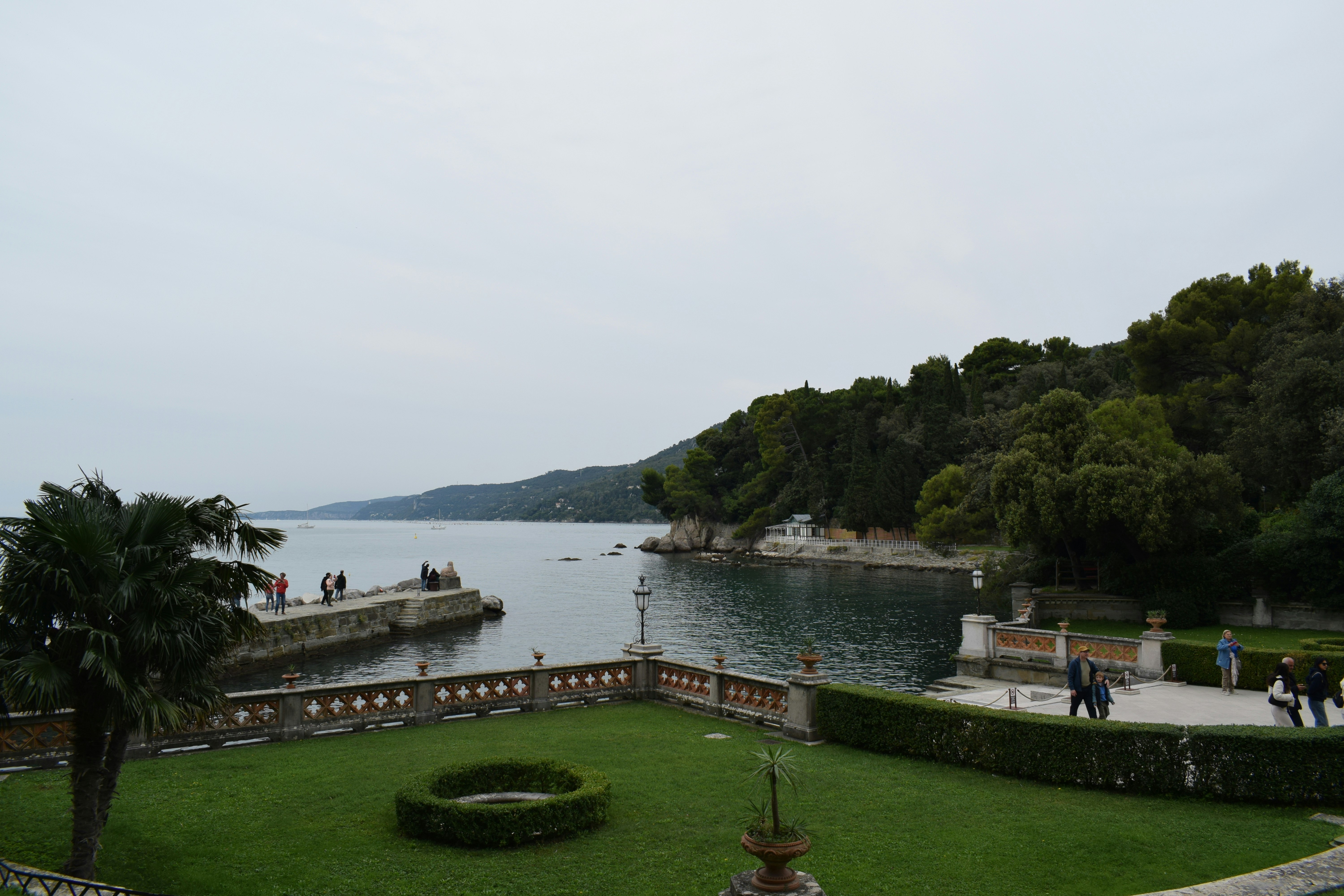 Coastal garden overlooking a calm bay with boats