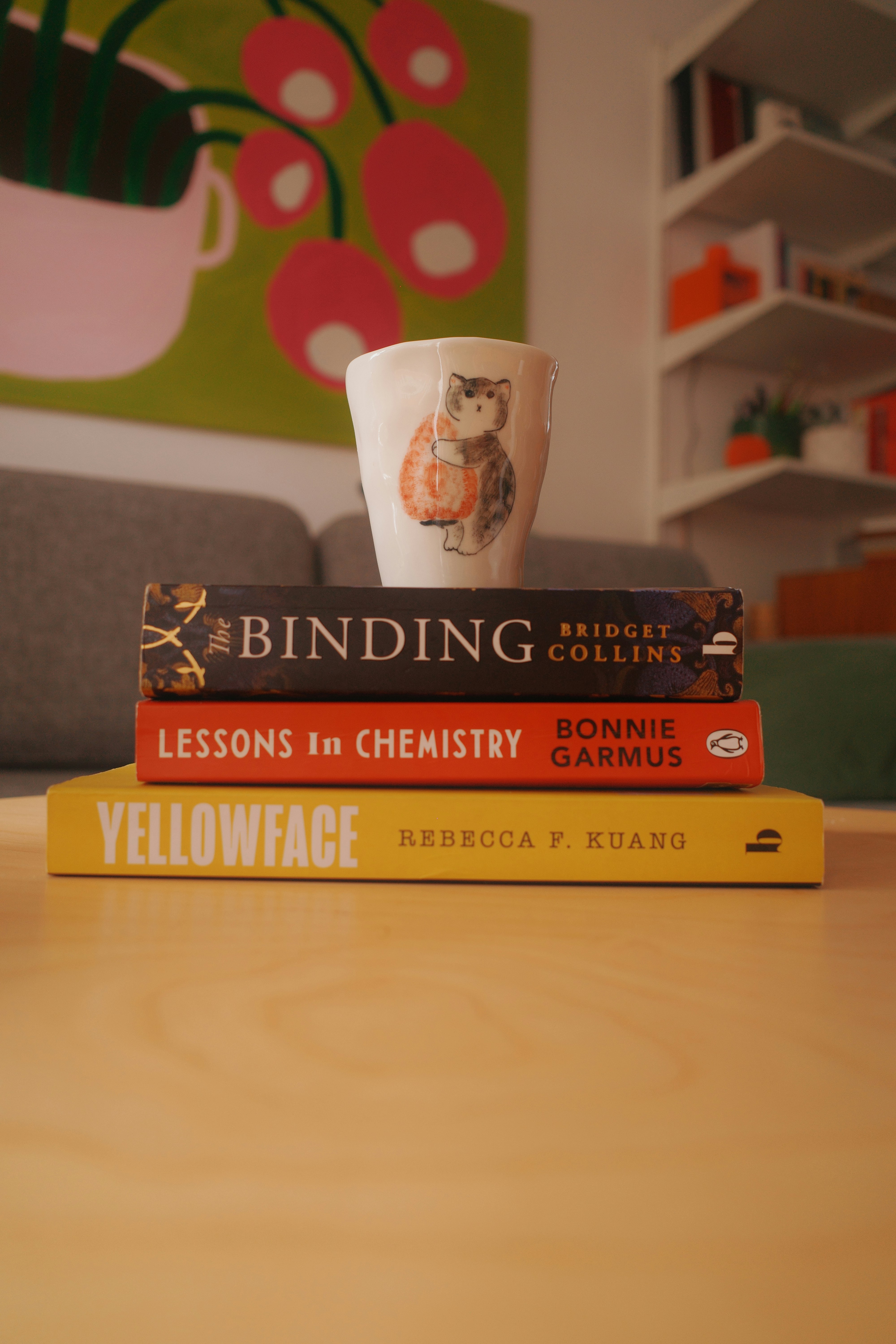 Stack of books with a mug on top