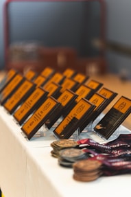 Rows of awards and medals displayed on a table.