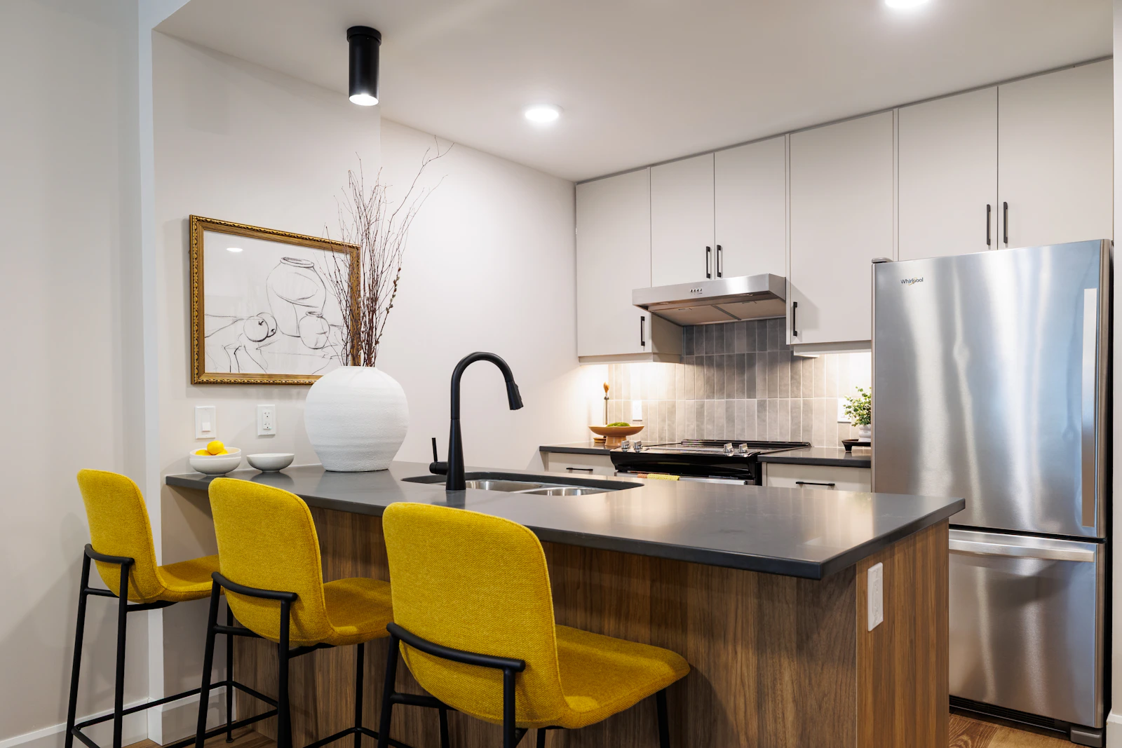 Metal stools tucked beneath a kitchen counter