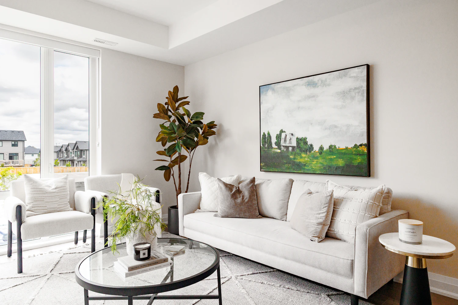 Living room with white sofa and artwork