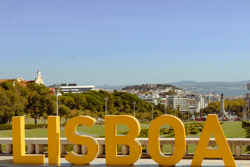 Large yellow lisboa letters with city view