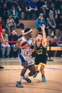 Basketball players competing on a court during a game.