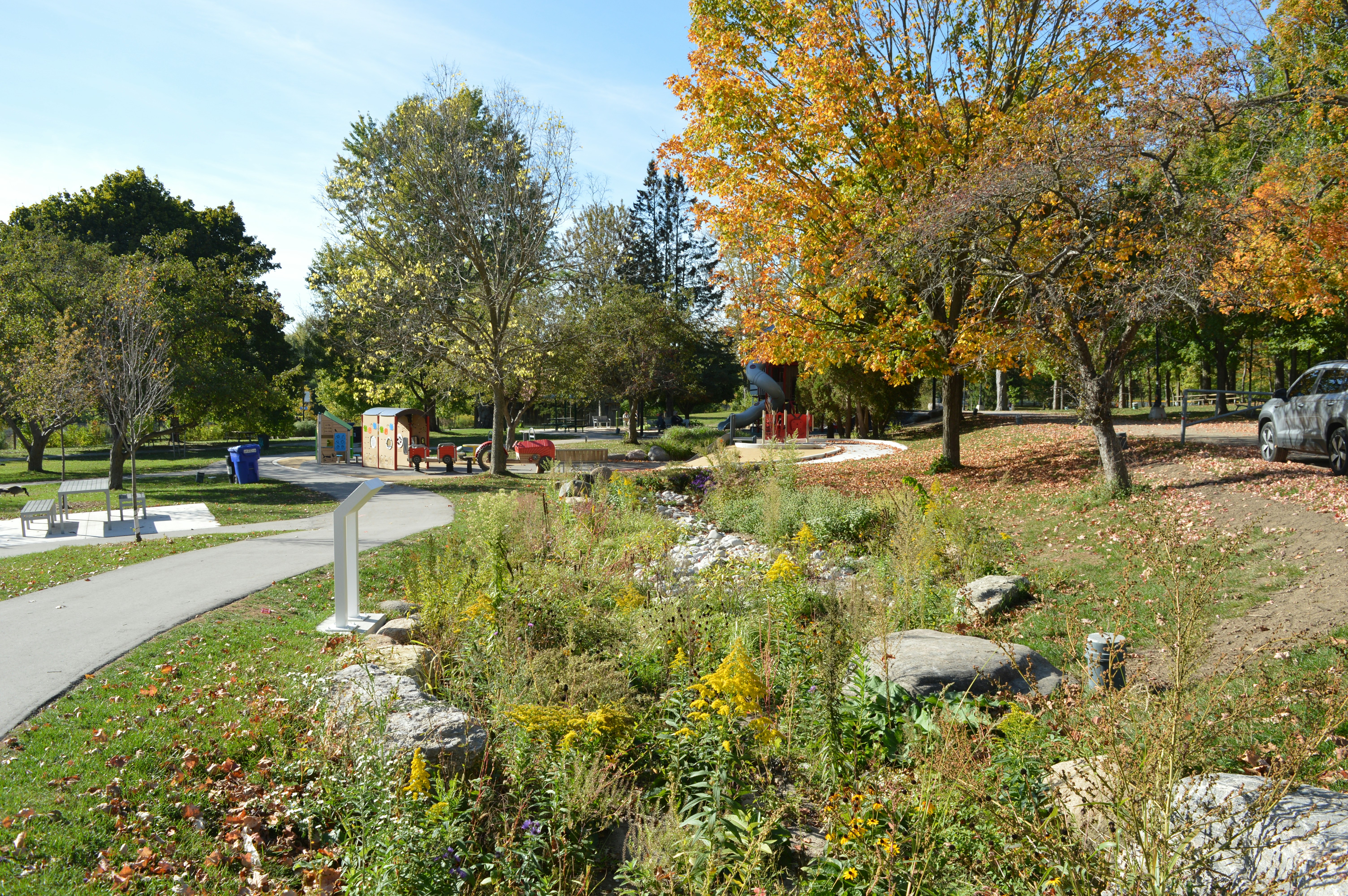 Autumn park with trees and playground equipment