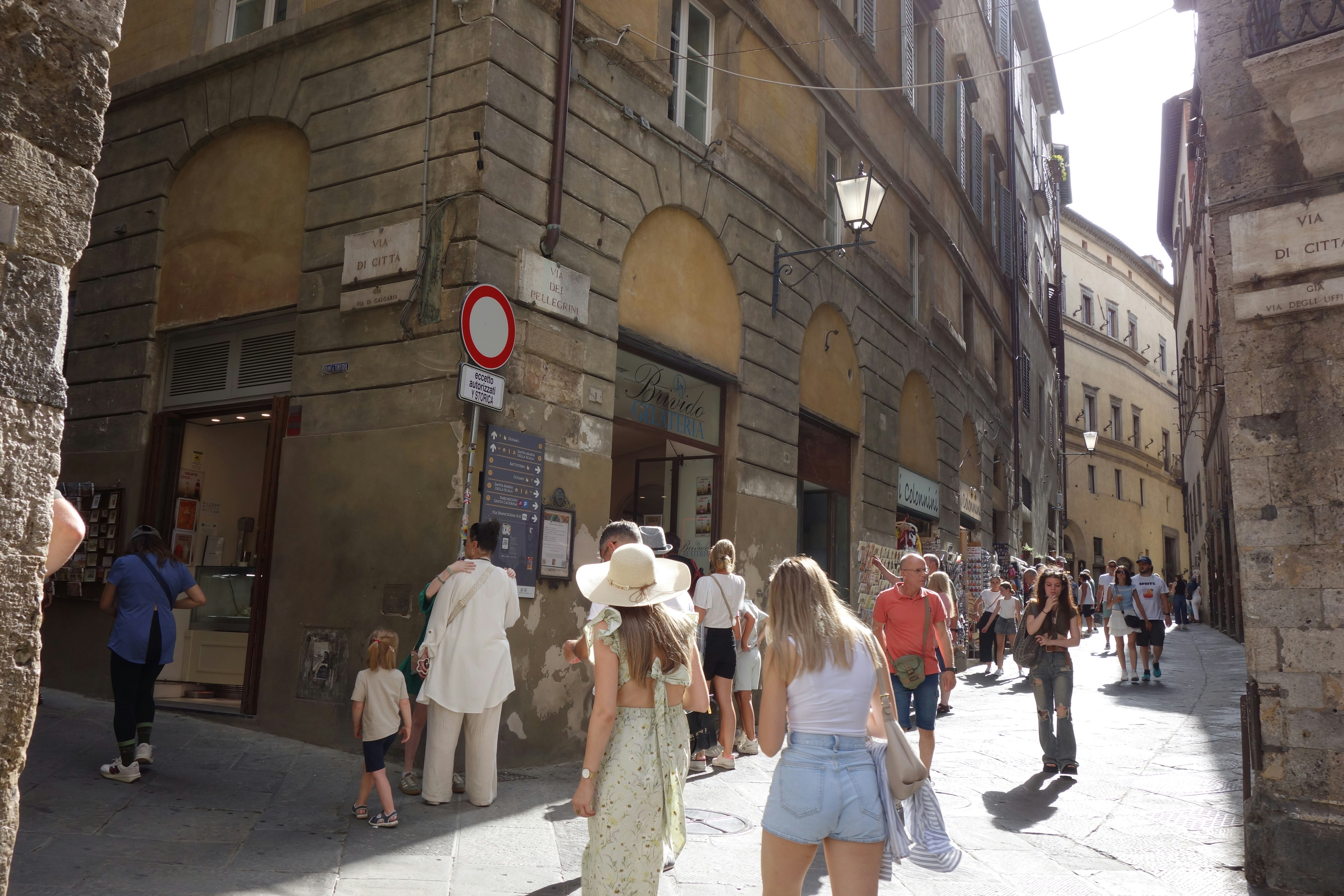 Woman walking through historic city street