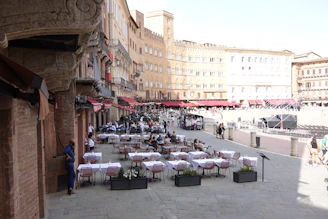 Outdoor cafe tables set up in a european piazza.