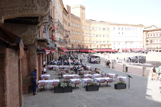 Outdoor cafe tables set up in a european piazza.