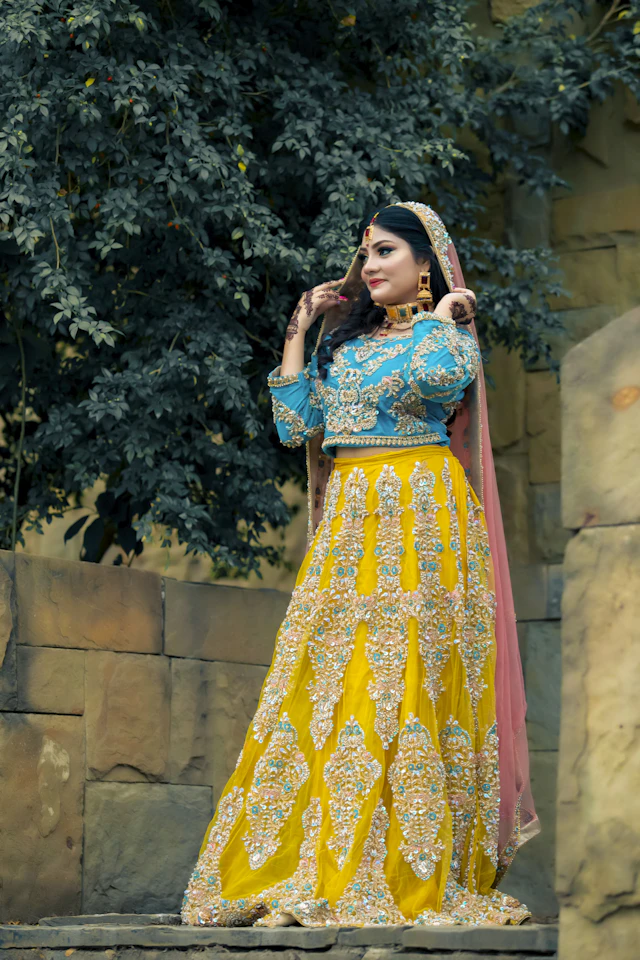 Woman wearing a yellow lehenga with a blue dupatta — AI virtual try-on preview
