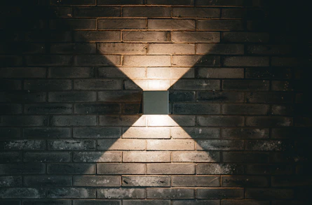 Square light fixture on a brick wall