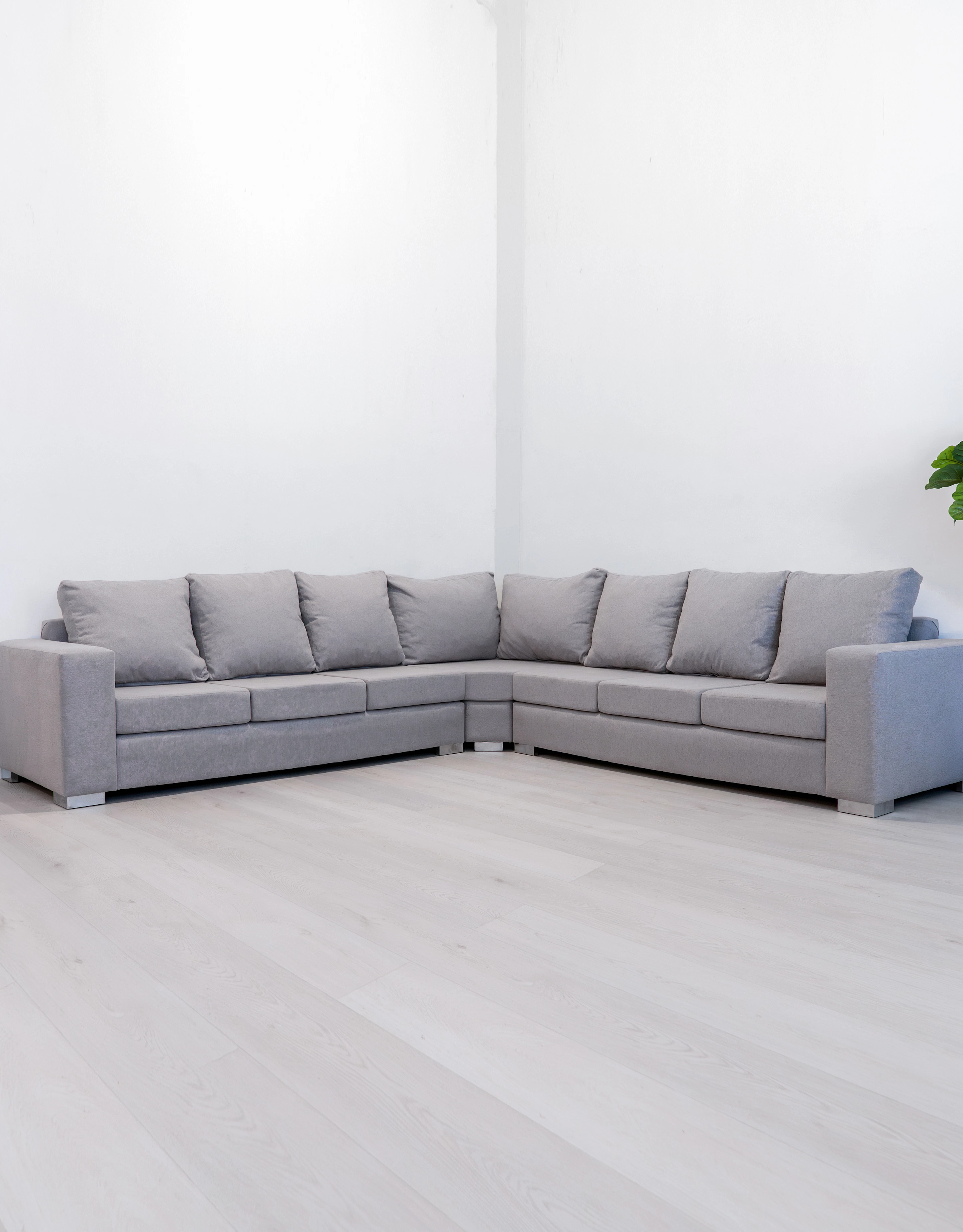 Grey sectional sofa in a minimalist room