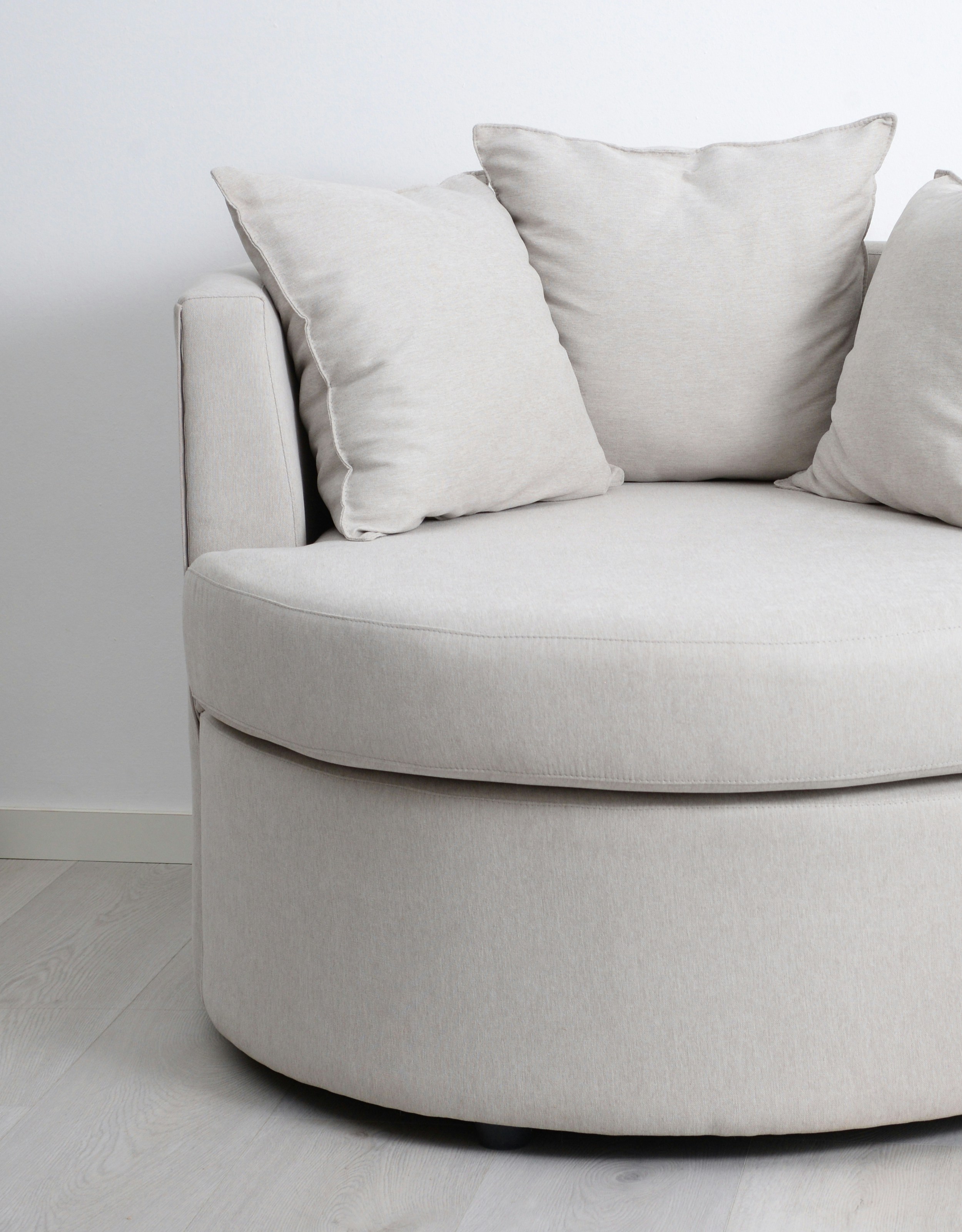 A comfy white outdoor sofa.