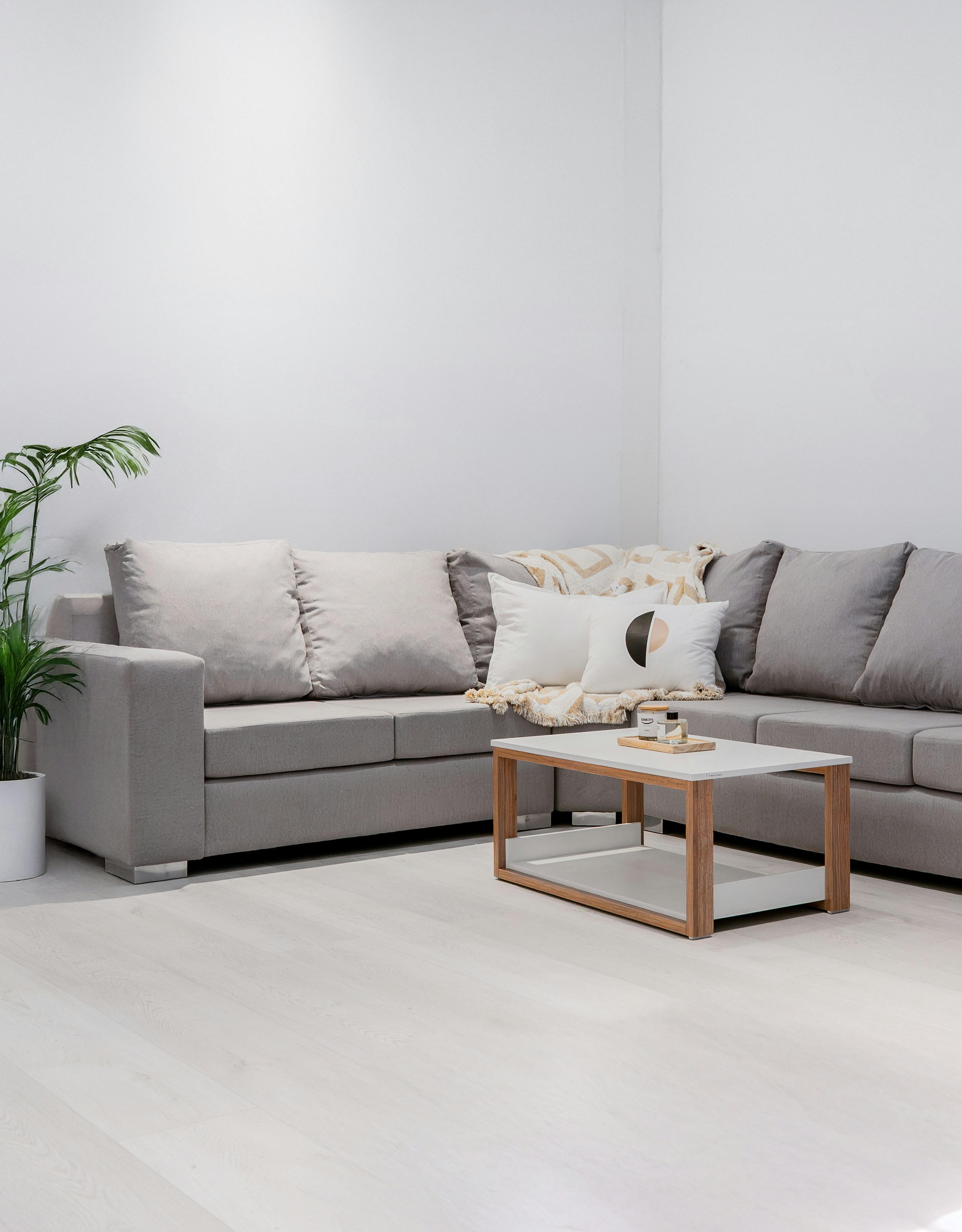A modern living room with a gray sectional sofa.