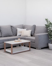 Gray sectional sofa with a modern coffee table.