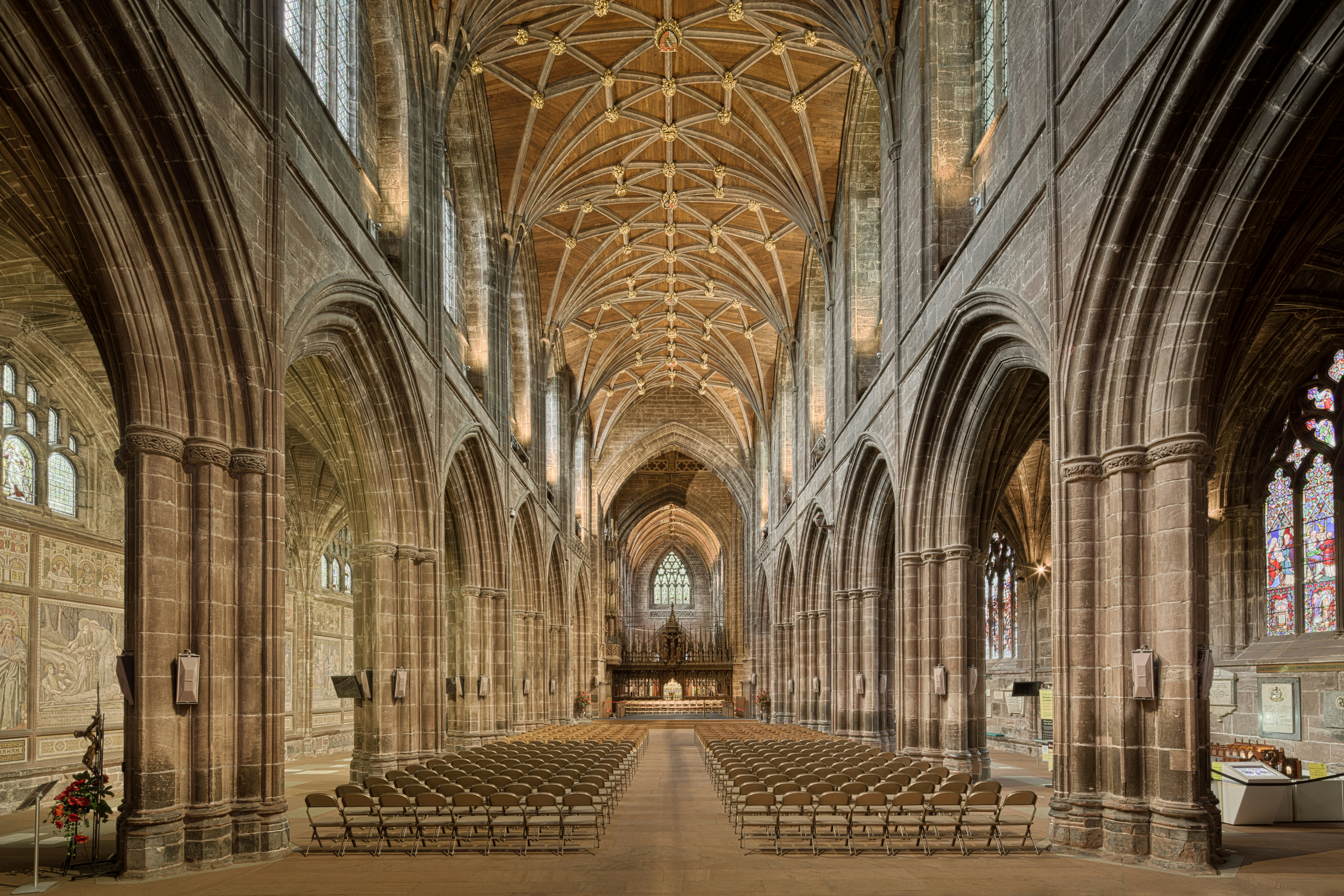 Grand cathedral nave with vaulted ceiling and rows of seats