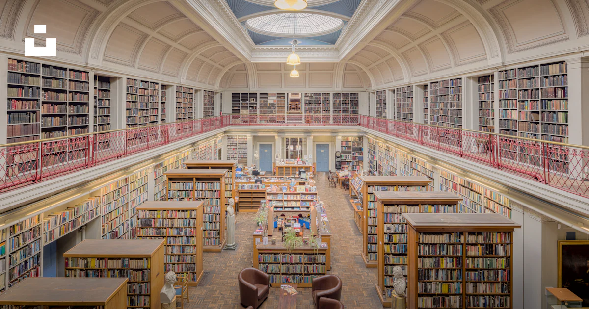 Grand library interior with tall bookshelves and reading areas photo ...