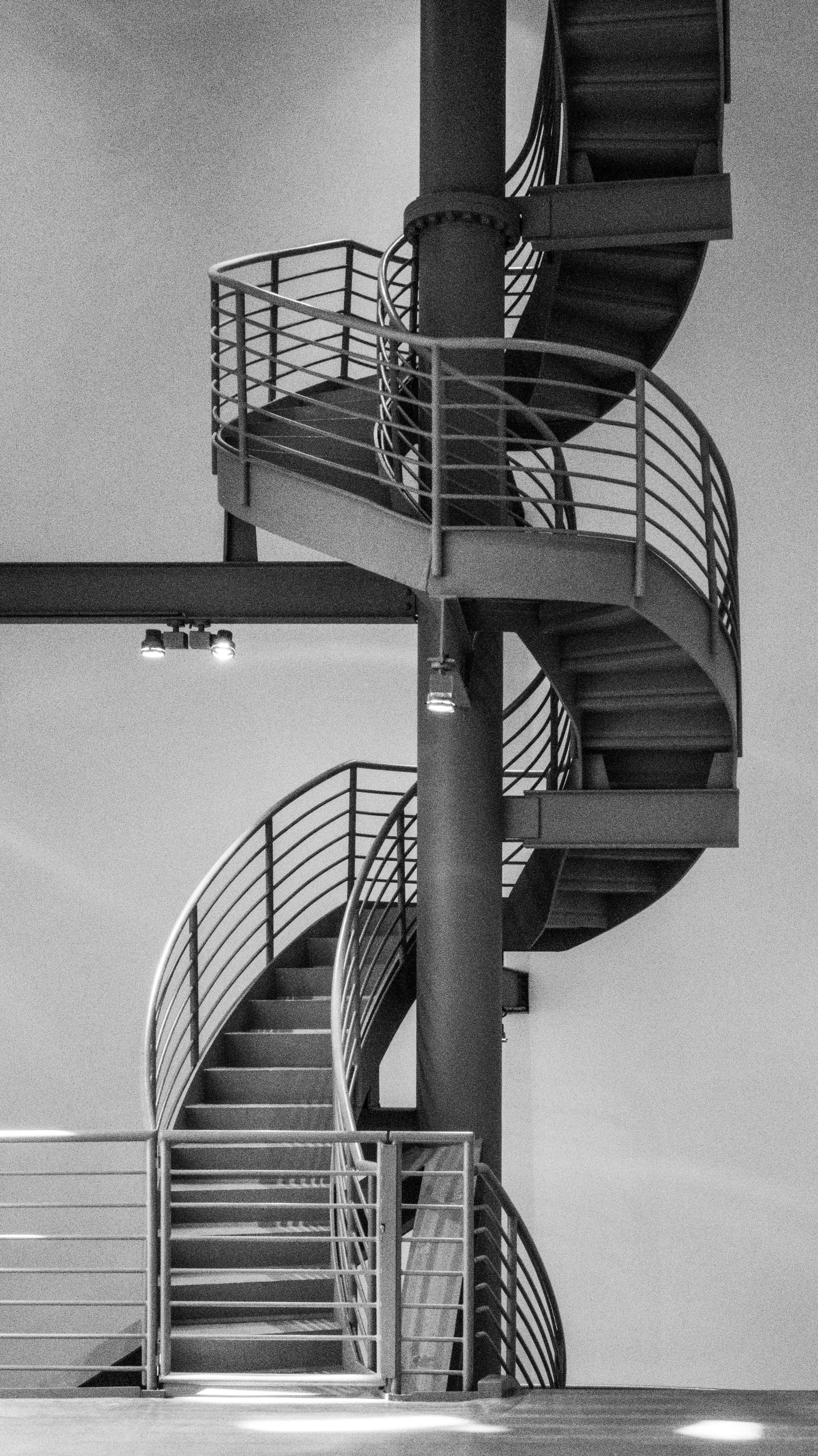 A black and white spiral staircase indoors