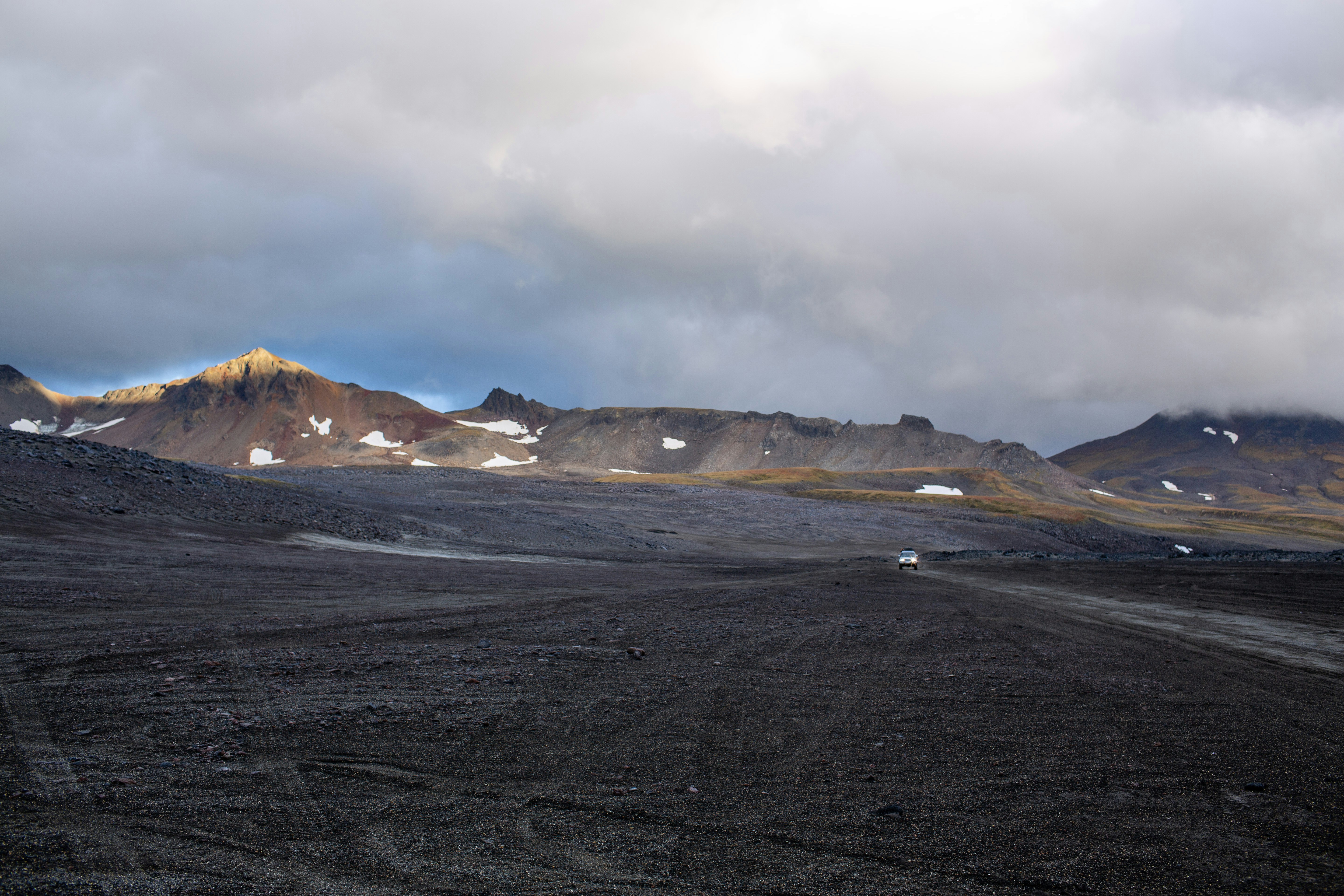 Rocky mountains under a cloudy sky