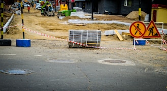 Road construction with warning signs and materials