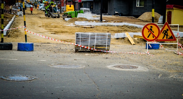 Road construction with warning signs and materials