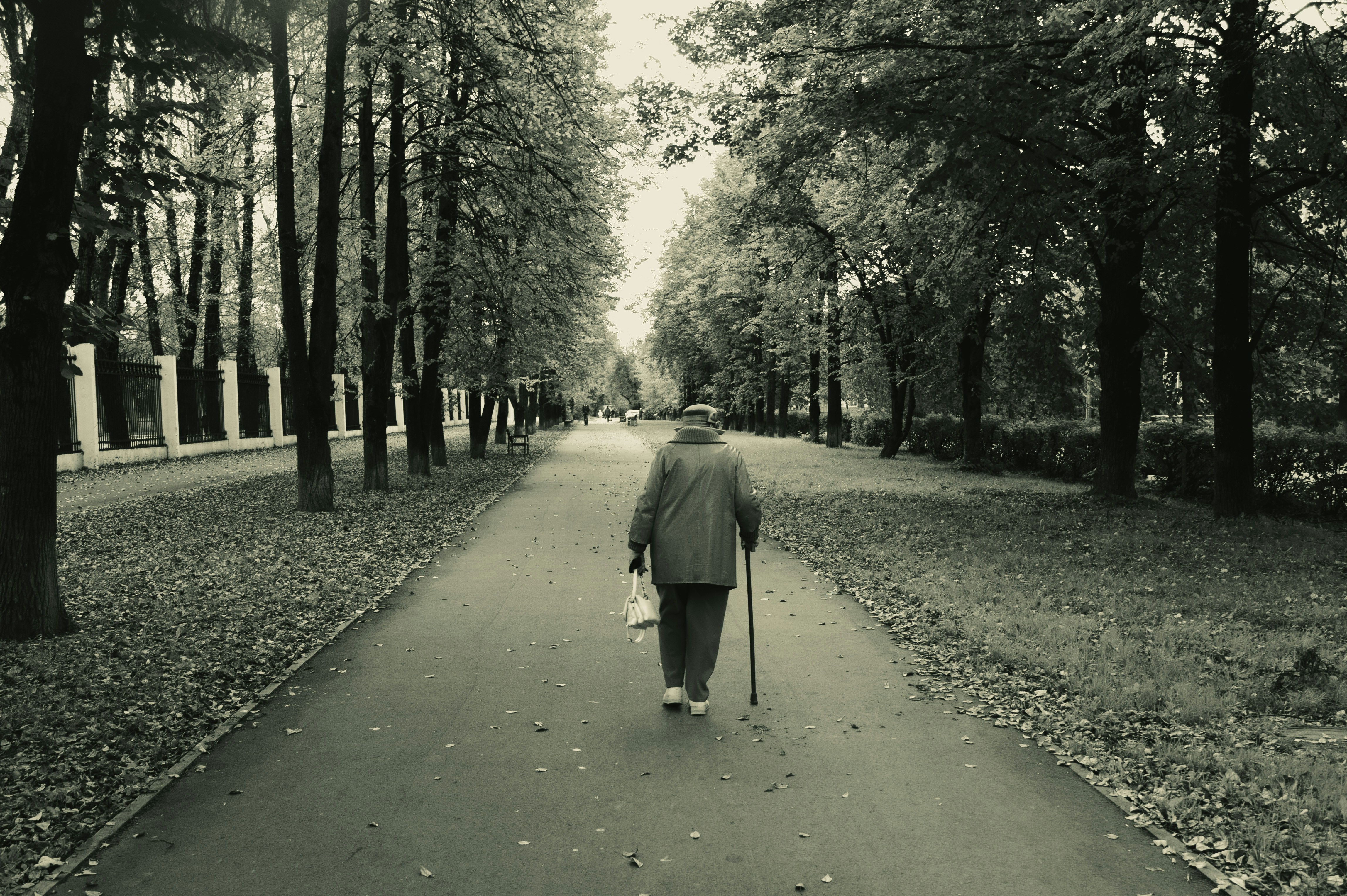 older adult walking outdoors - fall prevention strategies