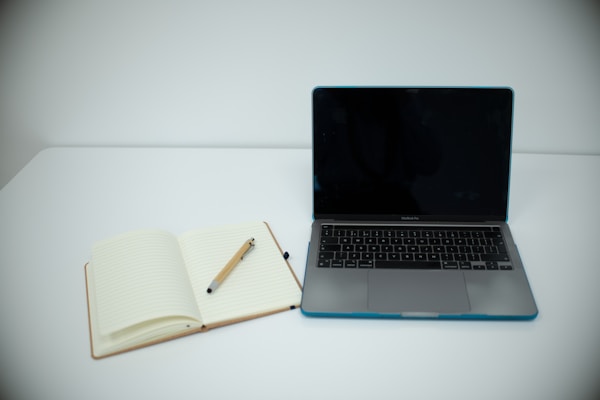 Clean desk with notebook and pen