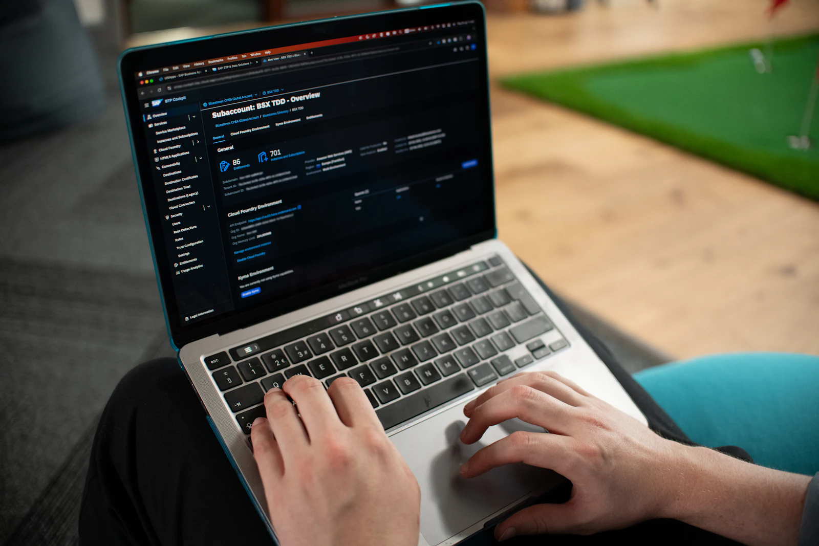 A business user reviewing a cloud services and enterprise software dashboard on a laptop