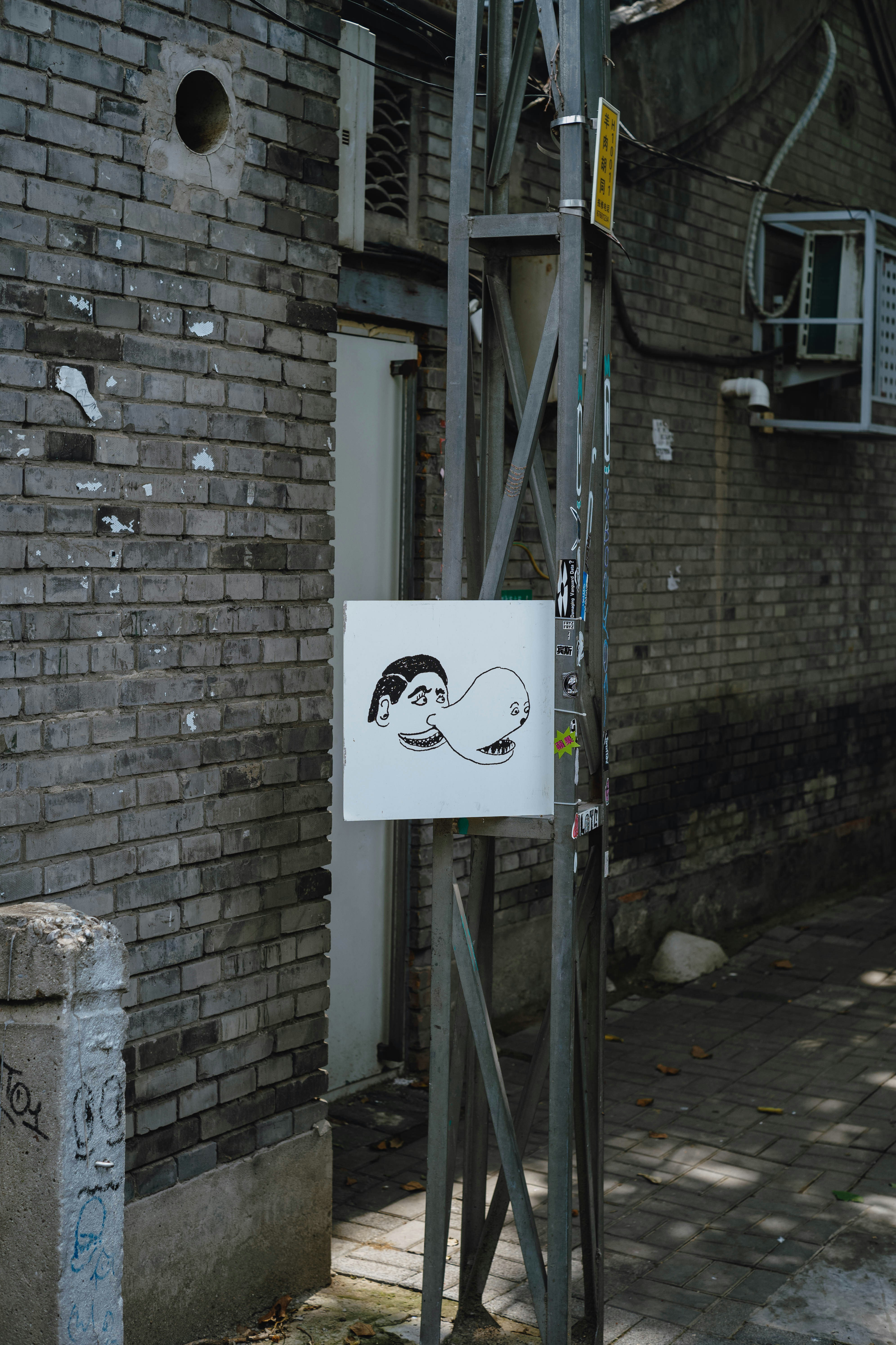 Street art of a face blowing a bubble