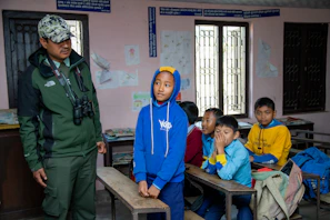 Ranger teaching children in a classroom