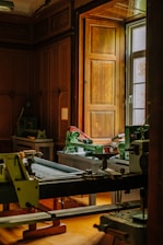Workshop with woodworking machinery and large window