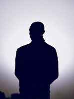 Silhouette of a person against a bright background
