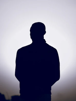 Silhouette of a person against a bright background