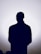 Silhouette of a person against a bright background